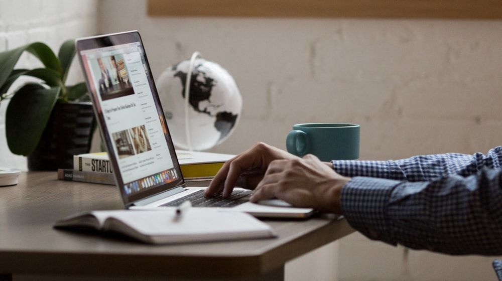 What Are Premium Domains Man Typing On Laptop