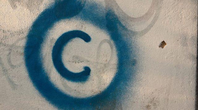 A Copyright Symbol Is Spraypainted on a Wal