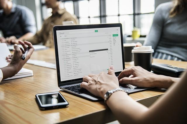 Woman Checking Computer Showing Professional Email