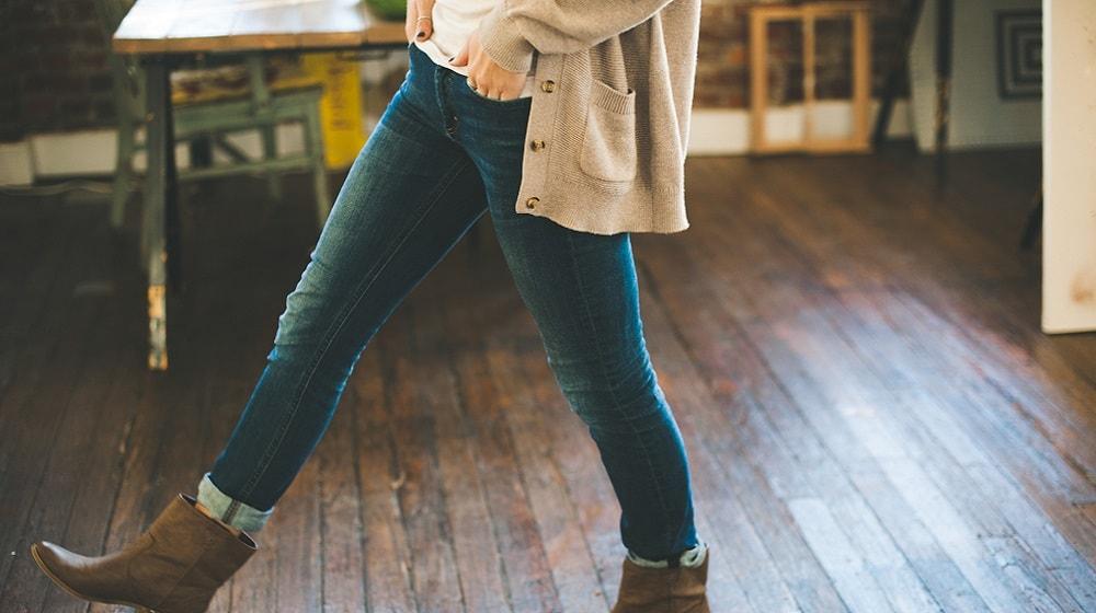 Woman Walking With Hands In Pockets