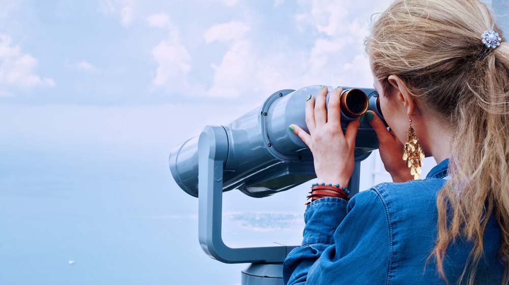 Woman Looking Through Binoculars