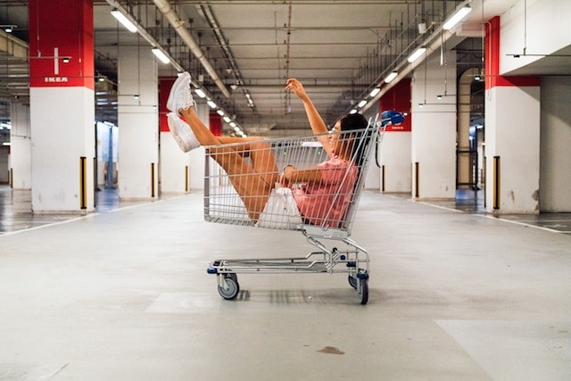 Writing A Business Plan Woman Sitting in Shopping Cart